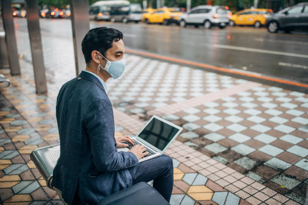istock Gentleman with pollution mask in coronavirus infected city downtown 1202978041