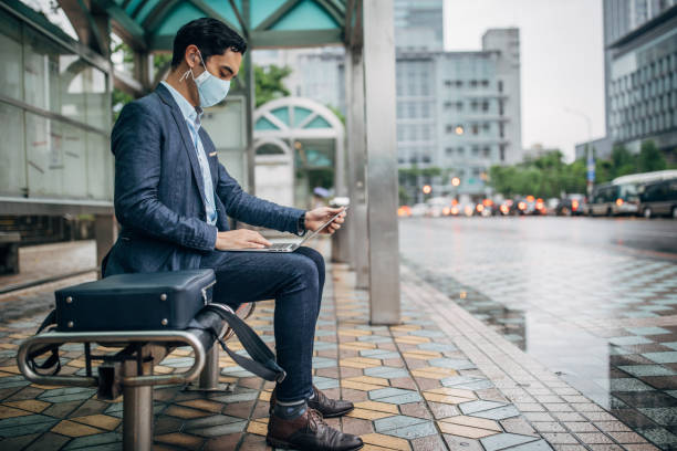 istock Gentleman with pollution mask in coronavirus infected city downtown 1202978152