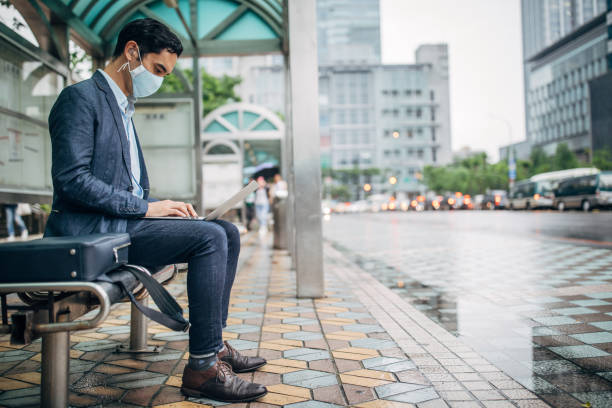 istock Gentleman with pollution mask in coronavirus infected city downtown 1202978185