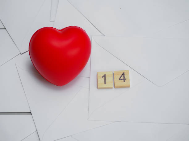 istock Red heart with numbers 14 on white letters envelopes background, use for wallpaper, card valentine day 1202978880