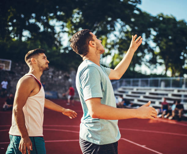 istock Basketball players on court 1202980323