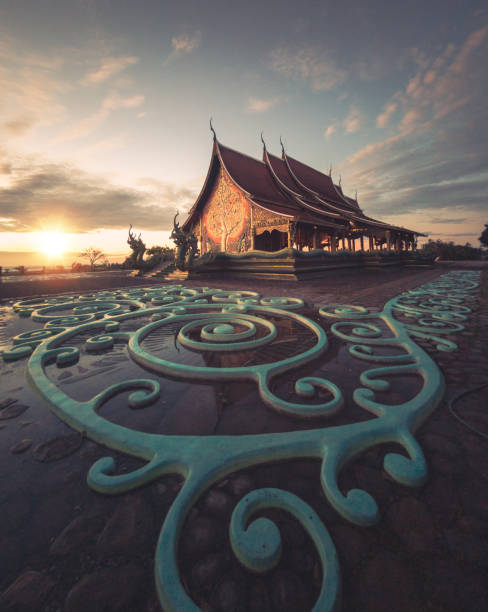 Sirindhorn Wararam Phu Prao is public Temple (Wat Phu Prao) at evening a glow of the sculpture of the Kalpapruek, which is attached to the wall behind the church.It will appear green glow in the night