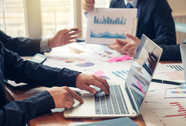 istock Investor group analyze information report financial graph at the meeting. 1202980816