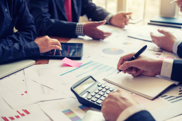 istock Investor group analyze information report financial graph at the meeting. 1202980905