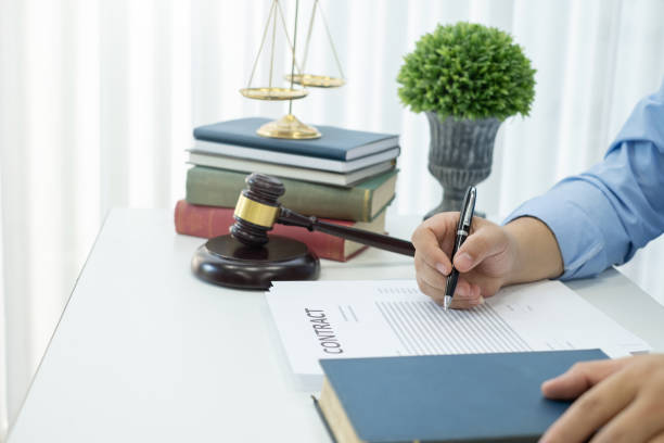 istock Lawyer and contract document in the office. 1202981747