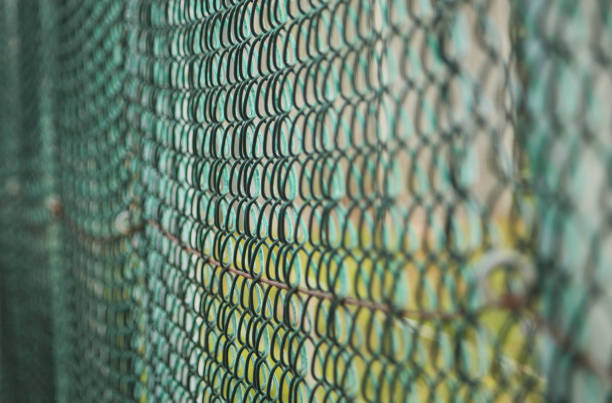 istock A white fence which has become rusted 1202981753
