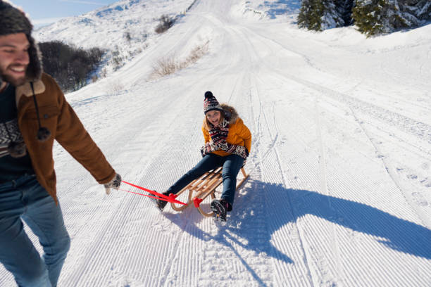 istock Kids In Love Having Fun Sledding 1202981975