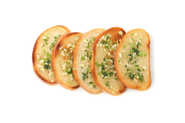 istock Toasted bread slices with garlic isolated on white background 1202982664