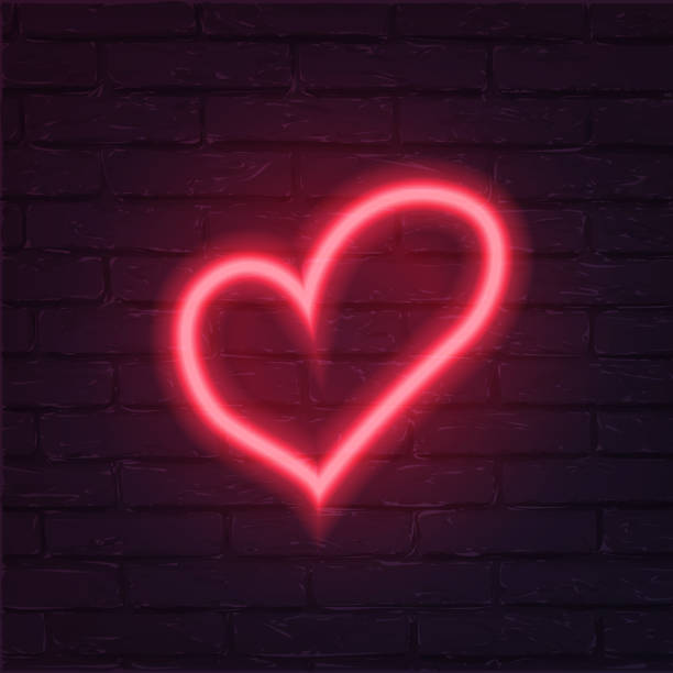istock Neon red heart vector illustration. Romantic icon isolated on brick wall background. Love holiday celebration symbol. Valentine postcard, greeting card decorative design element. 1202983507
