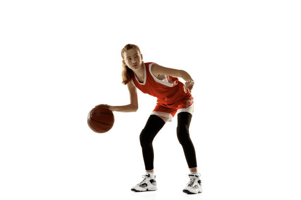 istock Young caucasian female basketball player against white studio background 1202983543