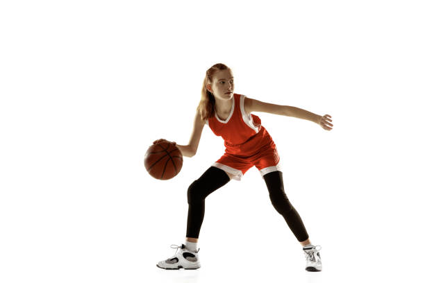 istock Young caucasian female basketball player against white studio background 1202983554