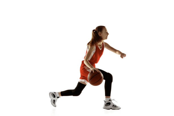 istock Young caucasian female basketball player against white studio background 1202983561