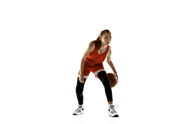 istock Young caucasian female basketball player against white studio background 1202983567