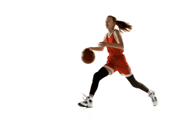istock Young caucasian female basketball player against white studio background 1202983585