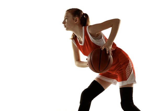 istock Young caucasian female basketball player against white studio background 1202983599