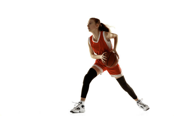 istock Young caucasian female basketball player against white studio background 1202983622