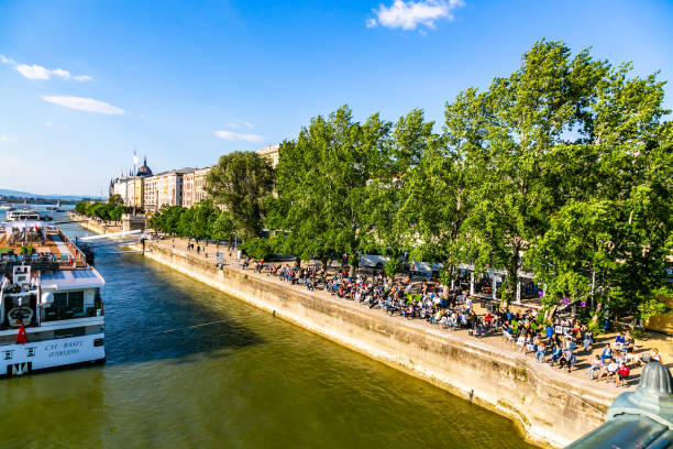 Budapest Danube bank Budapest, Hungary - May 01, 2019:People enjoying a spring day near the Chain Bridge in central Budapest. budapest danube river cruise hungary stock pictures, royalty-free photos & images