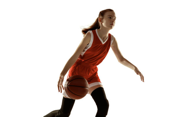 istock Young caucasian female basketball player against white studio background 1202983701