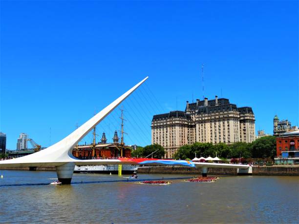 The Woman´s Bridge with argentinian and chinese flags. Buenos Aires, Argentina - January 26, 2020. The Woman´s Bridge with argentinian and chinese flags at the Puerto Madero waterfront in a sunny day. puente de la mujer stock pictures, royalty-free photos & images