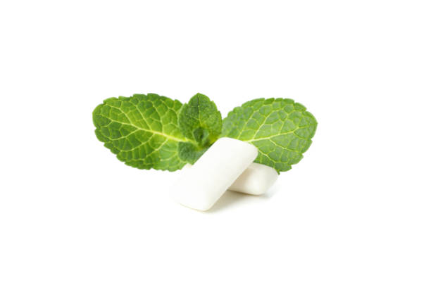 istock Mint leaves and gum isolated on white background 1202985835