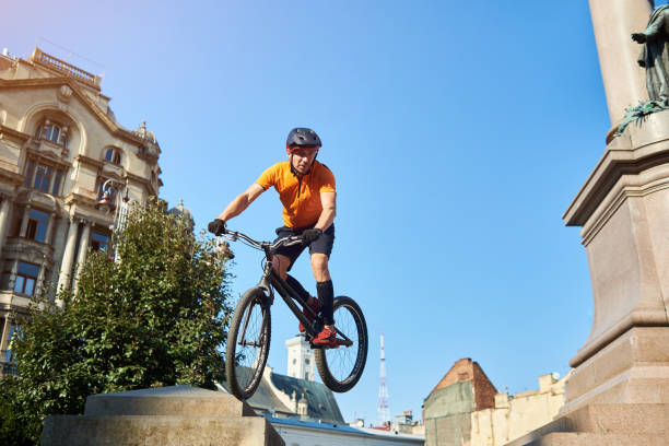 istock Athlete holding bicycle in hands and looking away. 1202986120