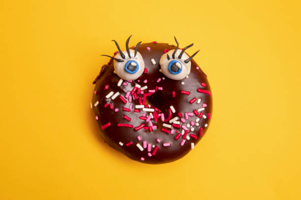 istock Funny Donut With Big Blue Eyes 1202989190