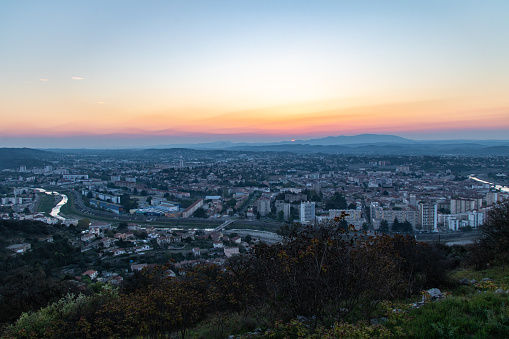 View of the city of Alès from the heights during sunrise.