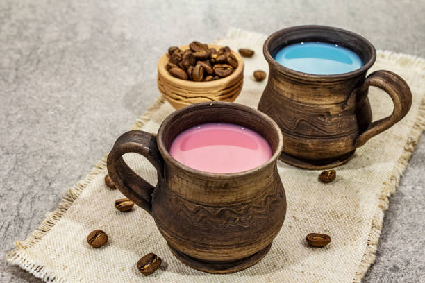 istock Trendy drink blue and pink latte. Lavender or spirulina and rose, beetroot or raspberry coffee. Stone concrete background 1203001333