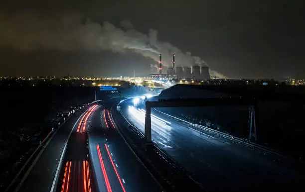 Ferrybridge power station with light trails on the dual carriageway.