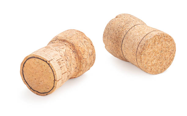istock Grapes wine bottle corks Isolated on white background. Wooden Cork macro 1203005017