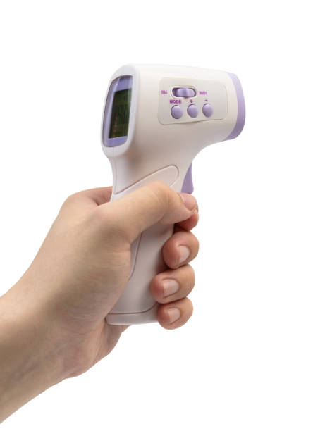 termometro a tenuta d'mano senza contatto - infrared thermometer foto e immagini stock