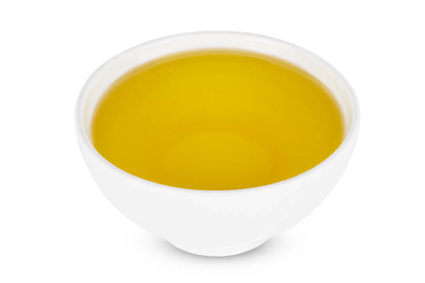 istock Sunflower oil in white bowl Isolated on a white background. 1203006363