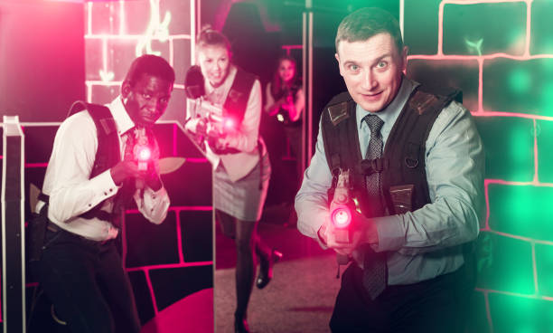 istock men and women co-workers having corporate entertainment 1203006858