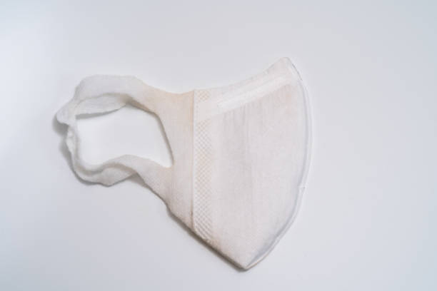 istock Protective medical mask on white background. 1203008063