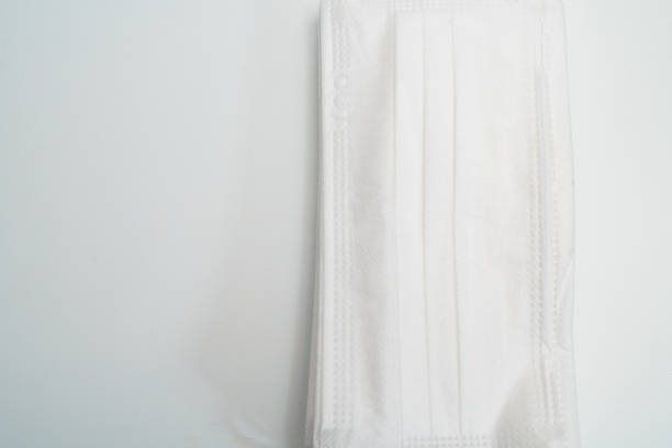 istock Protective medical mask on white background. 1203009296