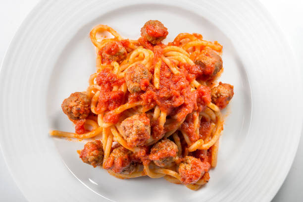 istock Plate of spaghetti with tomato and meatballs 1203009323