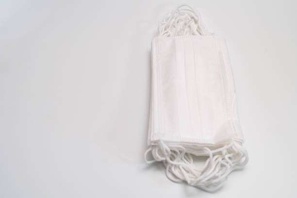 istock Protective medical mask on white background. 1203009339