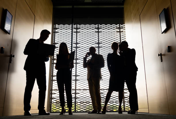 istock Group of Business People in modern office interior 1203009433