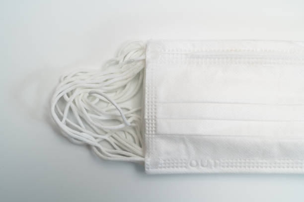 istock Protective medical mask on white background. 1203009442