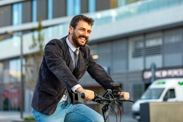 A Businessman on a Way to a Work with a Bike
