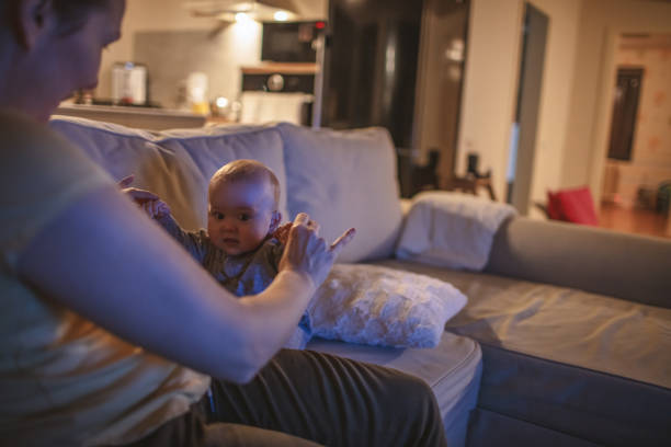 istock Mother playing with baby boy at home 1203014130