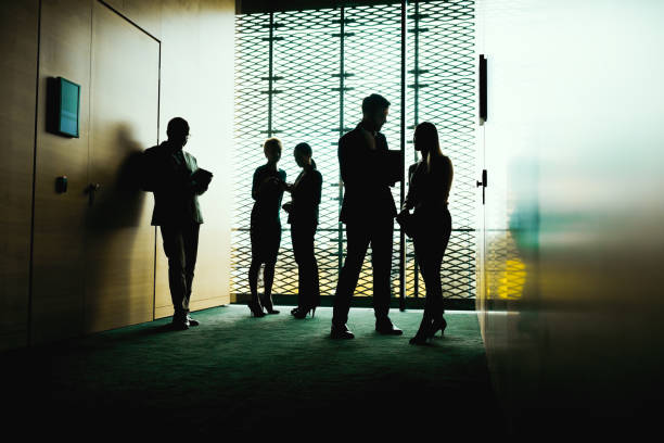istock Group of Business People in modern office interior 1203016509