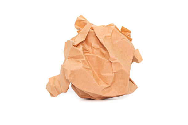 istock Crumpled brown Paper Ball isolated on white Background 1203017130