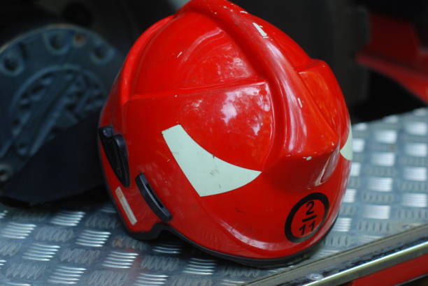 istock Fireman's  helmet, on the back of a fire engine, equipment 1203019478