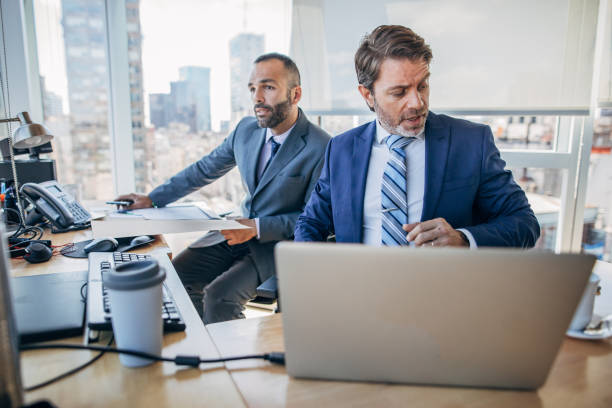 istock Businessmen working together in the office 1203021577