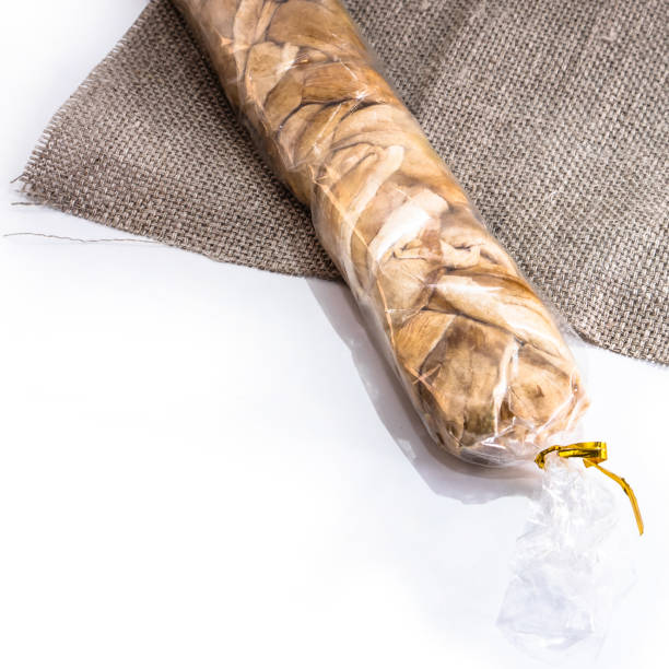 istock Cheese braid on a white isolated background. Food dried dried fruit for your website design. kitchen theme 1203024567