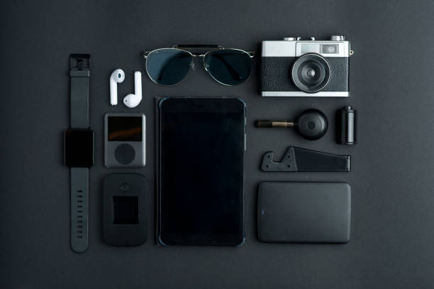 istock top view articles photographer, with black tablet, memory (USB), mobile support., cleaning knob, photo roll, retro photo camera, sunglasses, white headphones.producer (mp3), ruter, watch, 1203026508