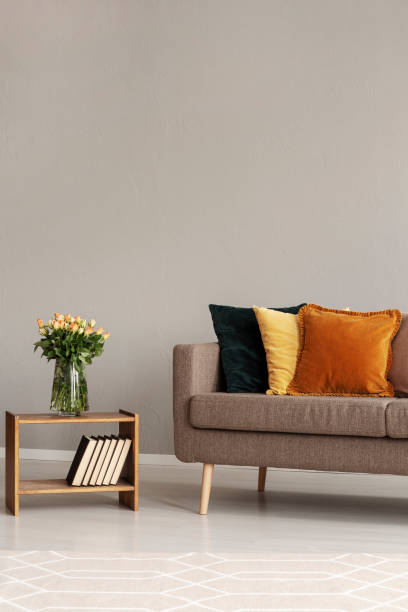 istock Vintage style grey living room interior with trendy sofa 1203028586