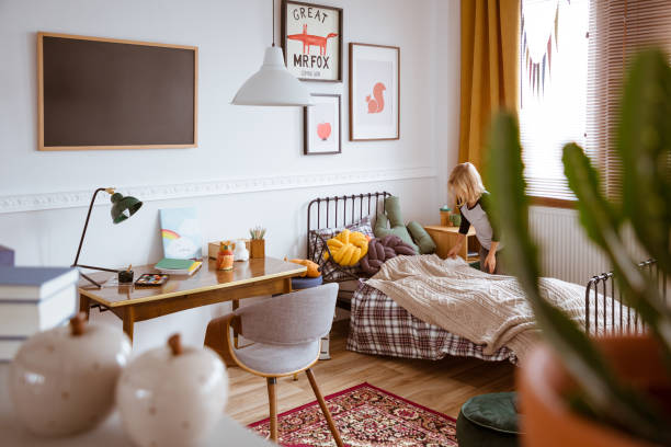 istock Trendy bedroom interior with bed and desk for school kid 1203028612