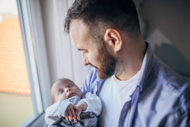 istock Father with his newborn son 1203031228